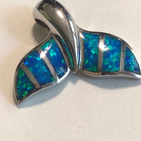 Jewelry - Women's sterling silver 'whale tail" pendant.